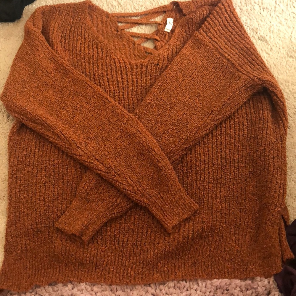 Long sleeve orange sweater.